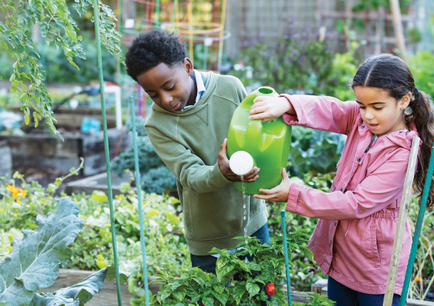 two children working in a community garden