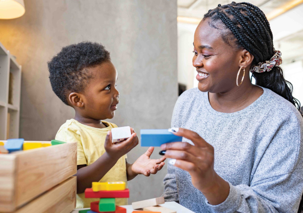 woman playing with her son